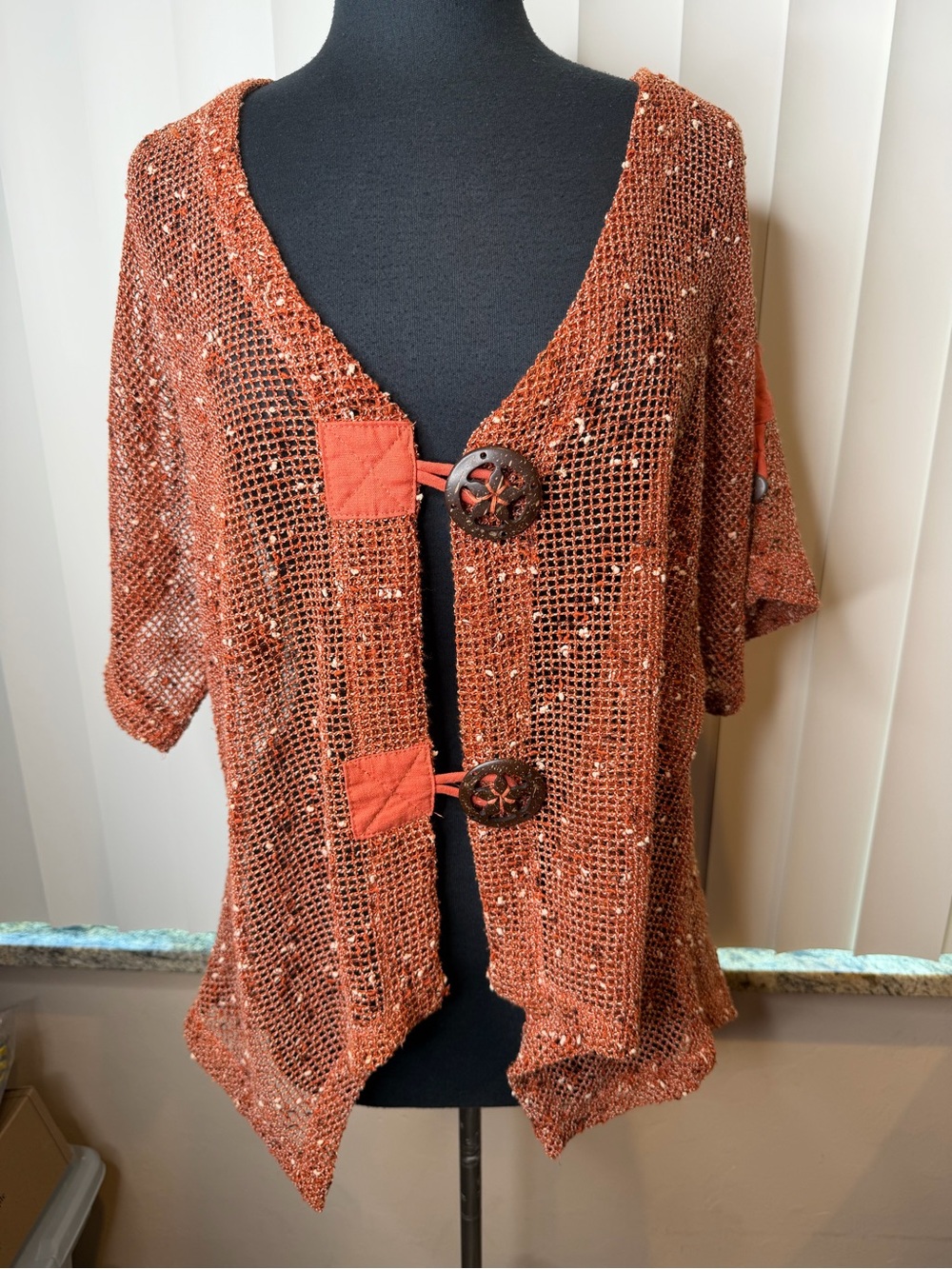 Kaktus bknit cardigan features a crochet mesh design in a burnt orange SZ Large